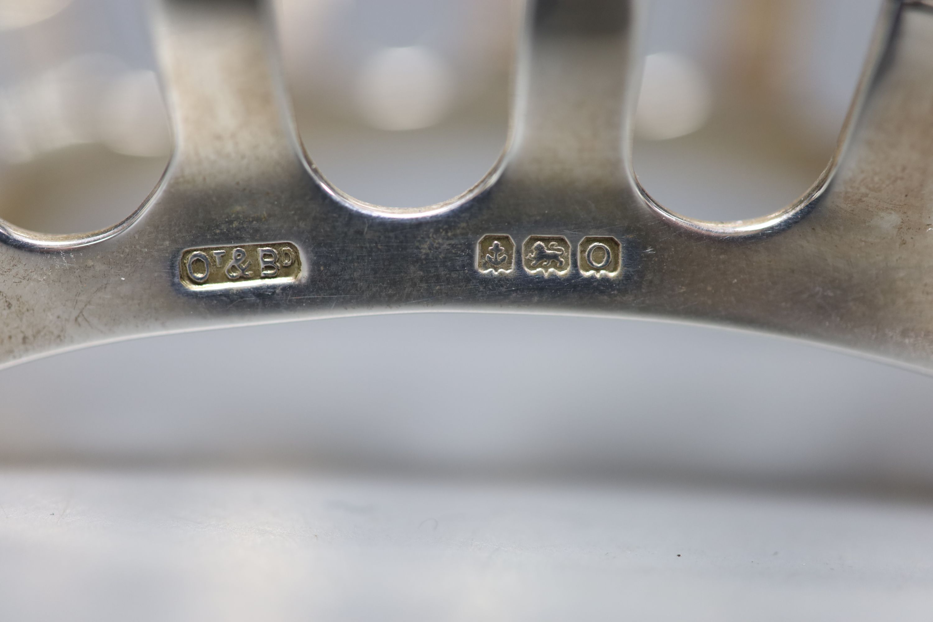 A George VI silver four division toast rack, Ollivant & Botsford, Birmingham, 1938, 11.5cm, 2oz.